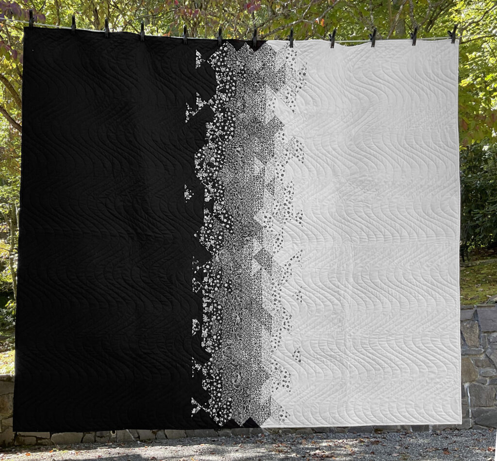 Modern geometric handmade quilt, rendered in timeless black and white.